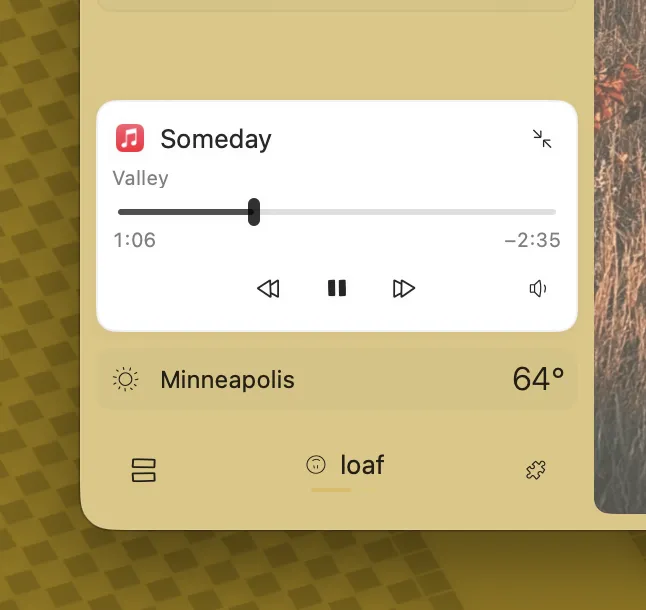the expanded miniplayer playing Cornfield Chase by Hans Zimmer, with seek and independent volume controls.